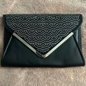 Black clutch with jewels.